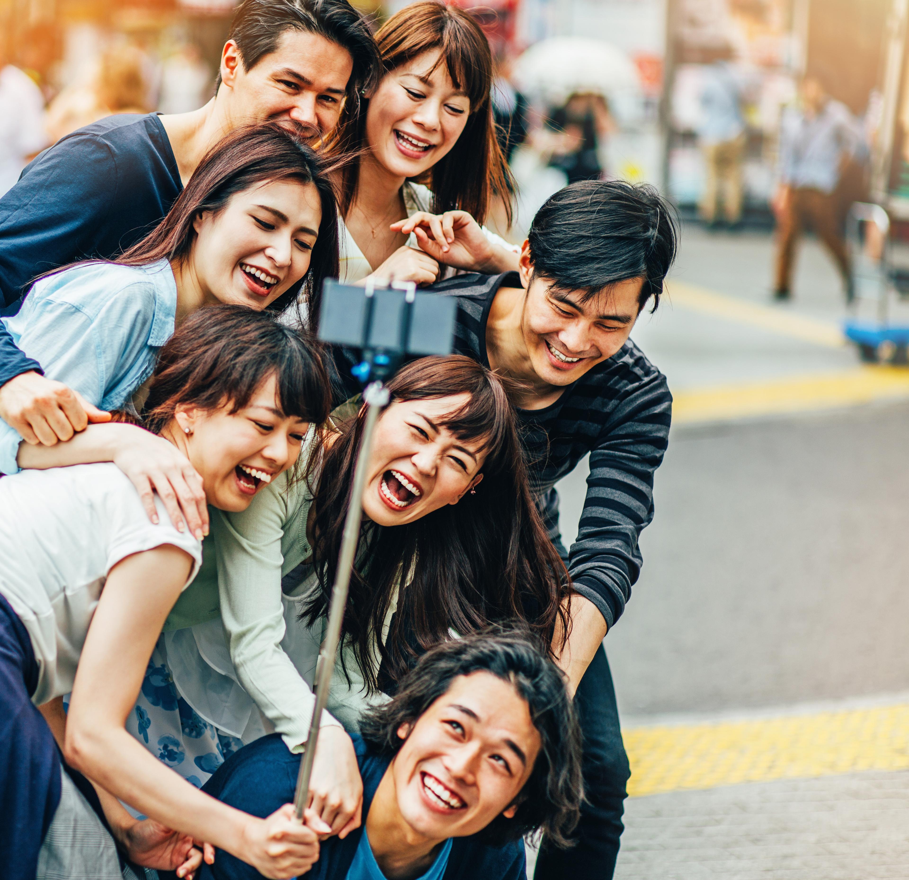 A group of people smiling for a selfie