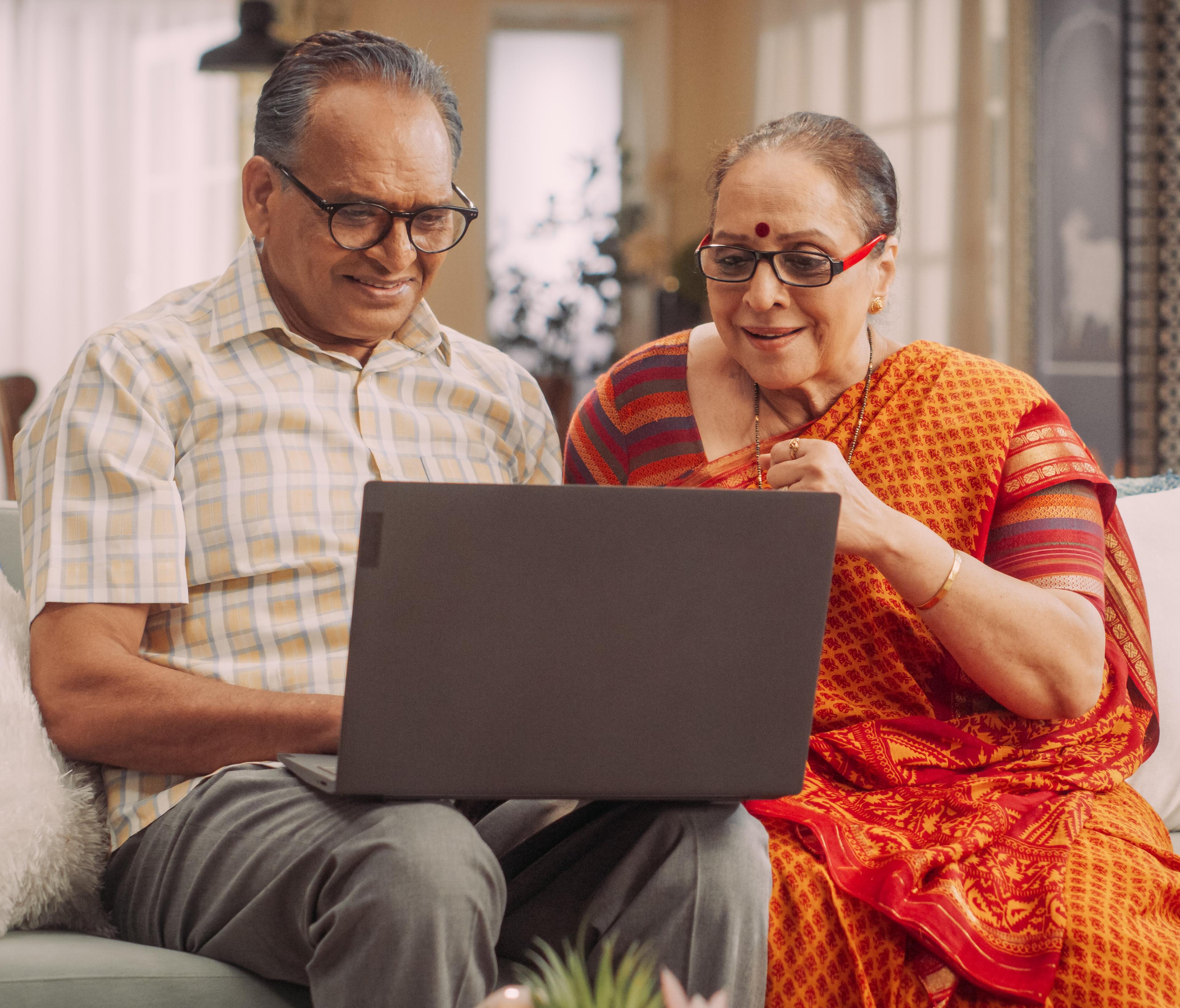 Married couple using a laptop computer